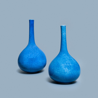 A pair of Chinese monochrome powder blue bottle vases, Kangxi